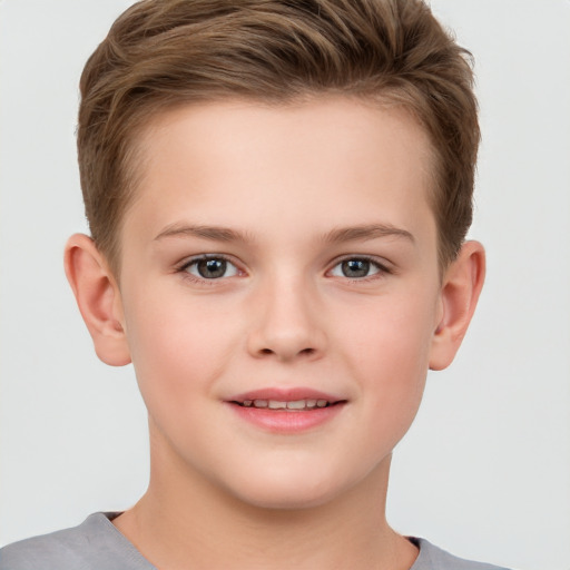 Joyful white child female with short  brown hair and brown eyes