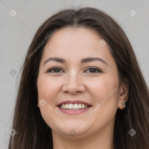 Joyful white young-adult female with long  brown hair and brown eyes