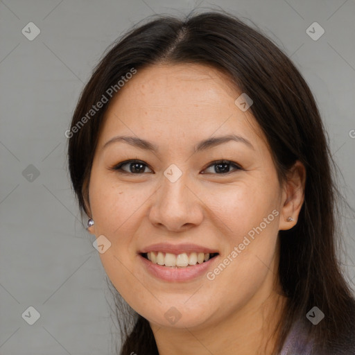 Joyful asian young-adult female with long  brown hair and brown eyes