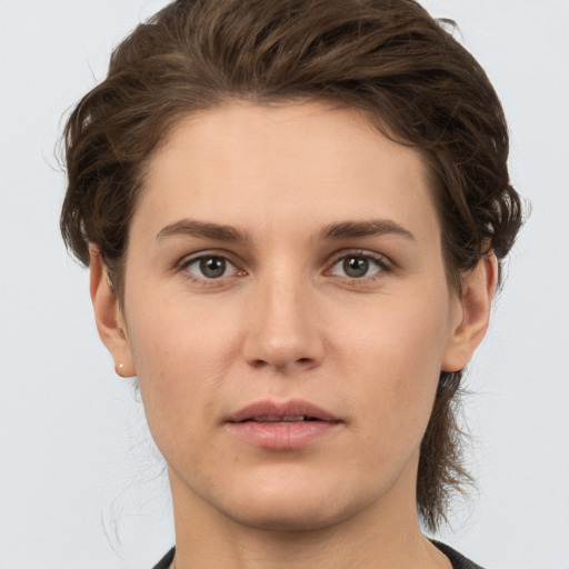 Neutral white young-adult female with short  brown hair and brown eyes