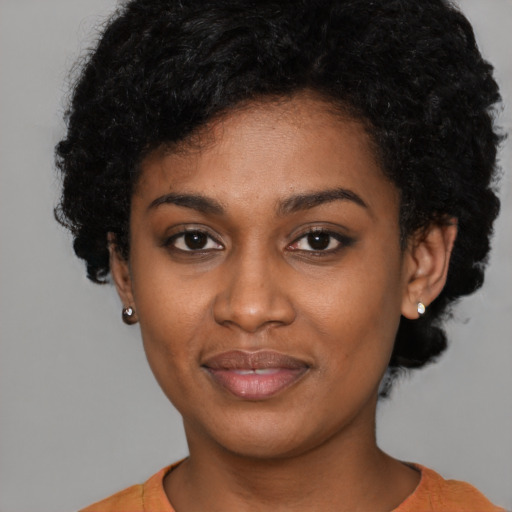 Joyful latino young-adult female with short  black hair and brown eyes