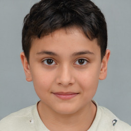 Joyful white child male with short  brown hair and brown eyes