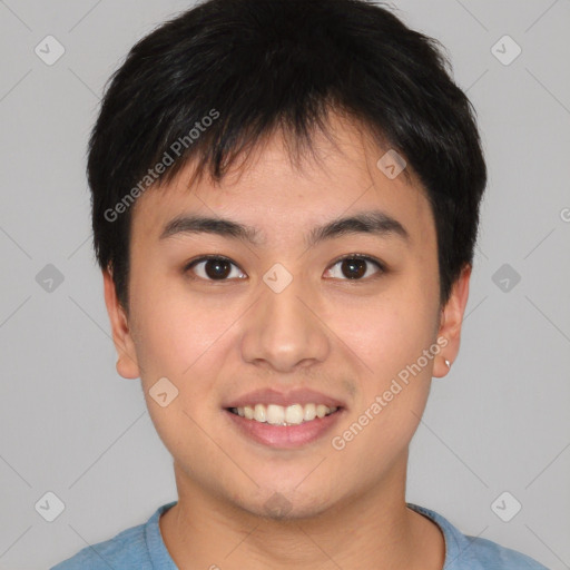 Joyful asian young-adult male with short  brown hair and brown eyes