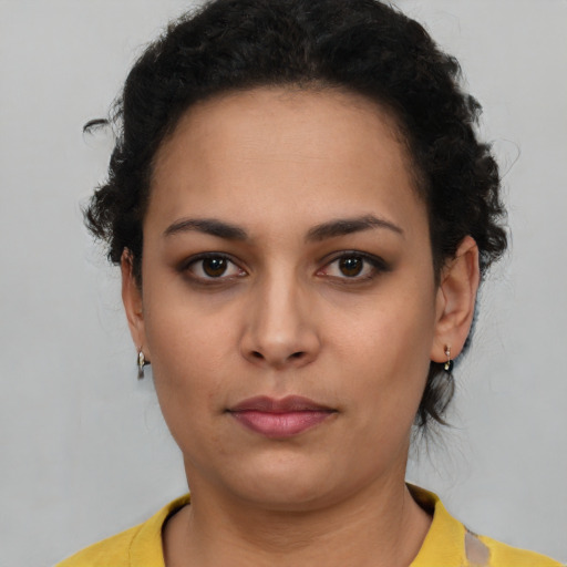 Neutral latino young-adult female with short  brown hair and brown eyes