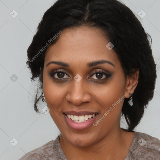 Joyful black young-adult female with long  black hair and brown eyes