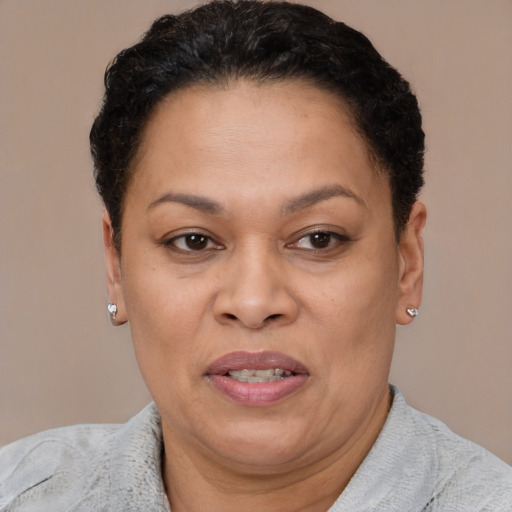 Joyful white adult female with short  brown hair and brown eyes