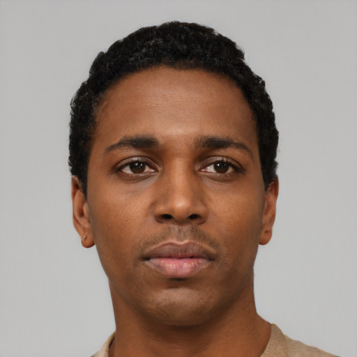Neutral black young-adult male with short  black hair and brown eyes