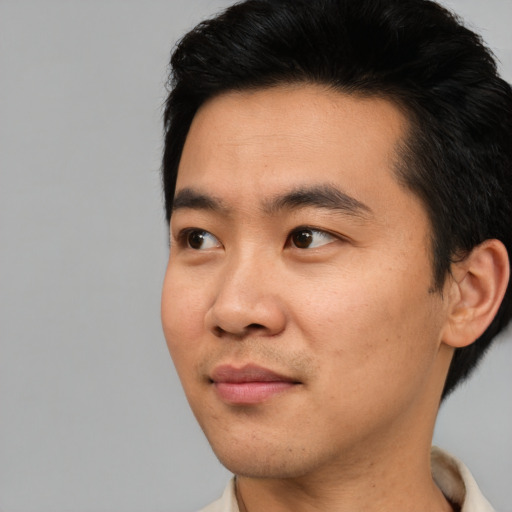 Neutral asian young-adult male with short  black hair and brown eyes