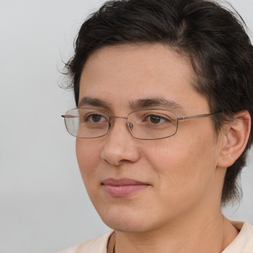 Joyful white adult female with medium  brown hair and brown eyes