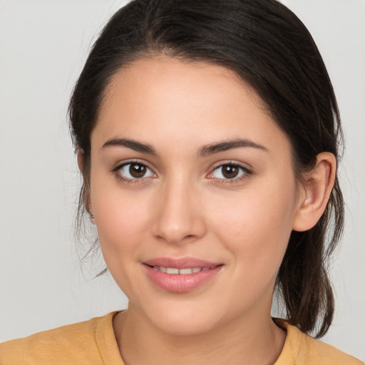 Joyful white young-adult female with medium  brown hair and brown eyes