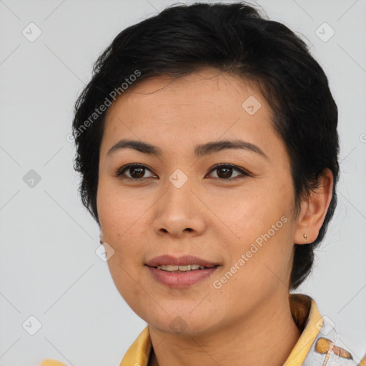 Joyful asian young-adult female with short  brown hair and brown eyes