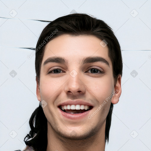 Joyful white young-adult male with short  black hair and brown eyes