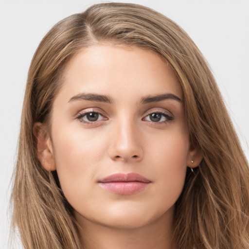 Neutral white young-adult female with long  brown hair and brown eyes