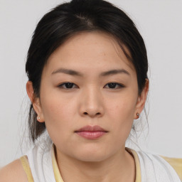 Neutral asian young-adult female with medium  brown hair and brown eyes