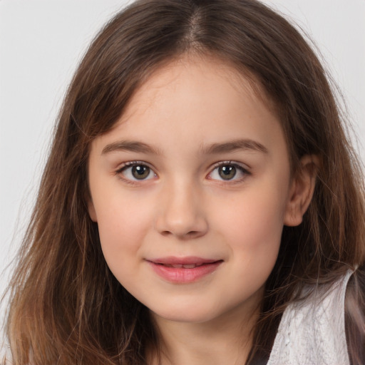 Joyful white child female with long  brown hair and brown eyes