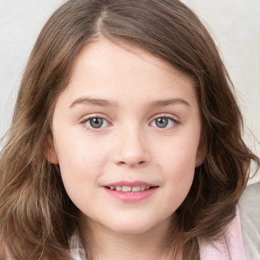 Joyful white child female with long  brown hair and grey eyes