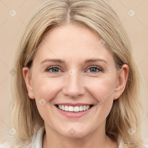 Joyful white young-adult female with medium  brown hair and blue eyes