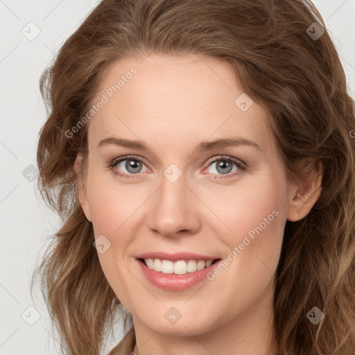 Joyful white young-adult female with long  brown hair and blue eyes