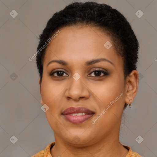 Joyful black young-adult female with short  brown hair and brown eyes