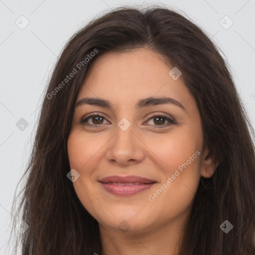 Joyful latino young-adult female with long  brown hair and brown eyes