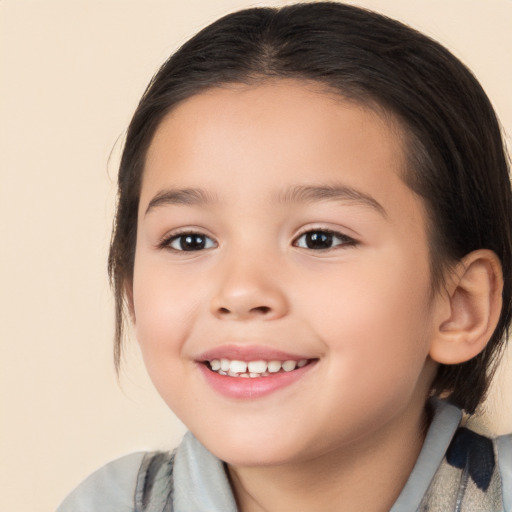 Joyful white child female with medium  brown hair and brown eyes