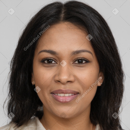 Joyful black young-adult female with long  brown hair and brown eyes