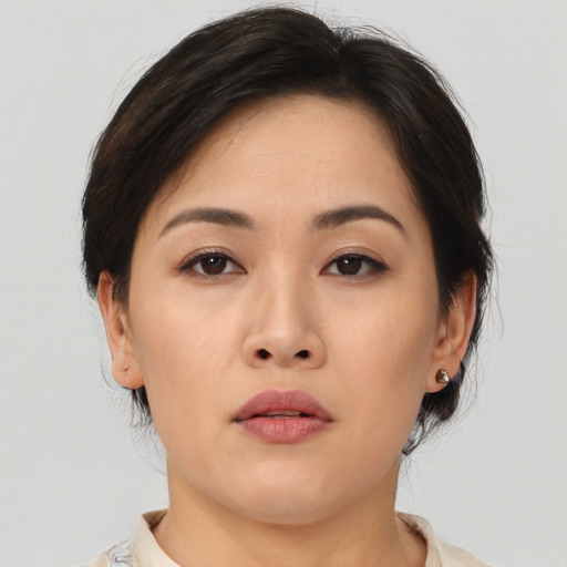 Neutral asian young-adult female with medium  brown hair and brown eyes