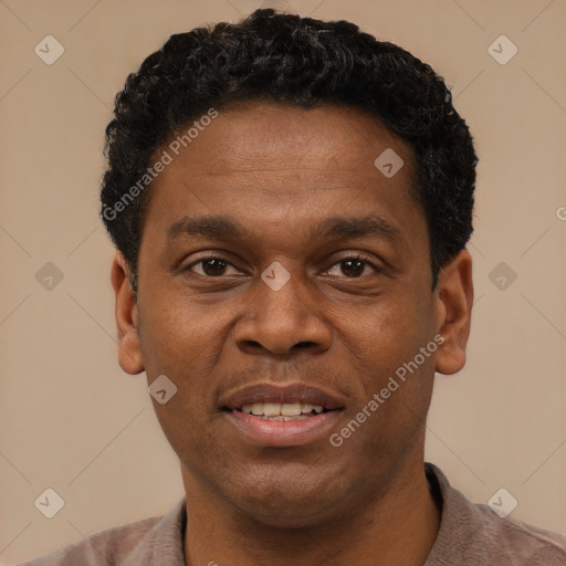 Joyful latino young-adult male with short  brown hair and brown eyes
