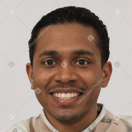 Joyful black young-adult male with short  black hair and brown eyes