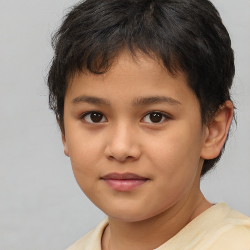 Joyful white child female with short  brown hair and brown eyes