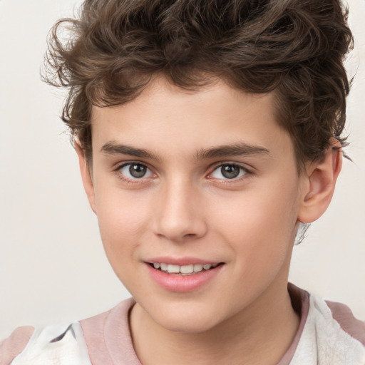 Joyful white child male with short  brown hair and brown eyes