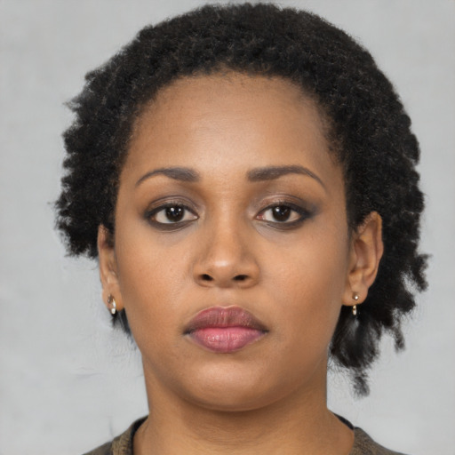 Neutral black young-adult female with short  black hair and brown eyes