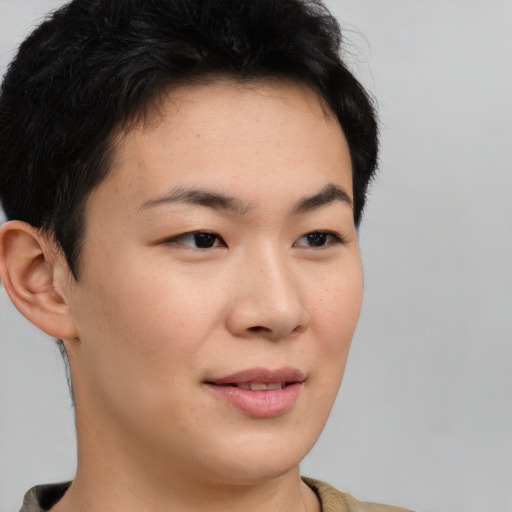 Joyful asian young-adult female with short  brown hair and brown eyes