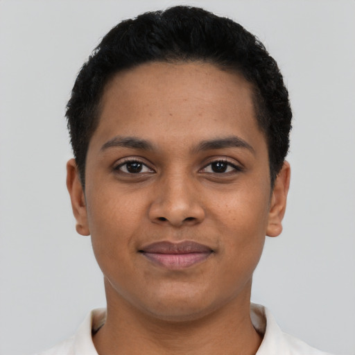 Joyful latino young-adult female with short  black hair and brown eyes