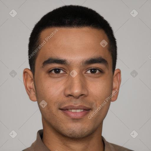 Joyful latino young-adult male with short  brown hair and brown eyes