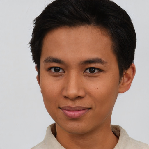 Joyful asian young-adult male with short  brown hair and brown eyes