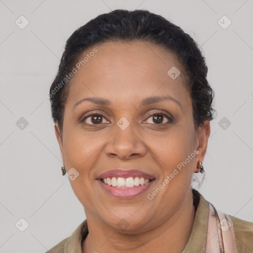Joyful latino adult female with short  brown hair and brown eyes