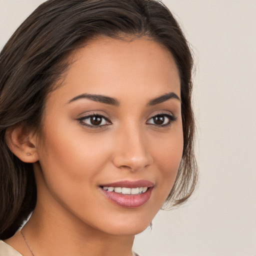 Joyful white young-adult female with medium  brown hair and brown eyes