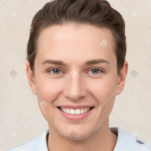 Joyful white young-adult female with short  brown hair and grey eyes