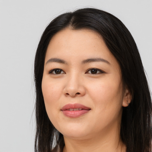 Joyful asian young-adult female with long  black hair and brown eyes