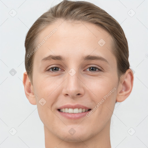 Joyful white young-adult female with short  brown hair and grey eyes