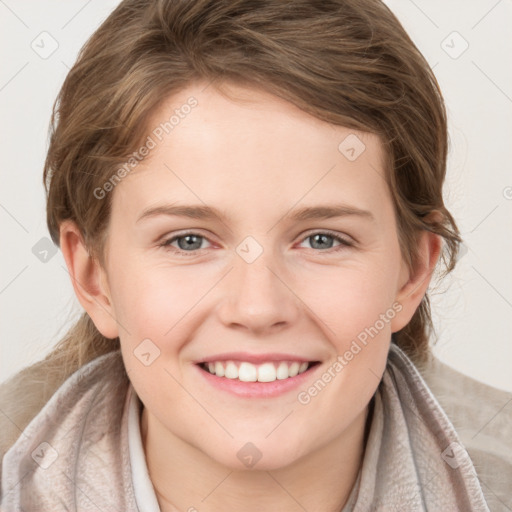 Joyful white young-adult female with medium  brown hair and blue eyes