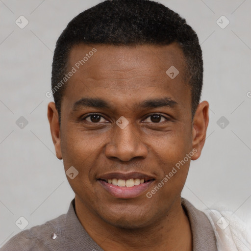 Joyful black young-adult male with short  black hair and brown eyes