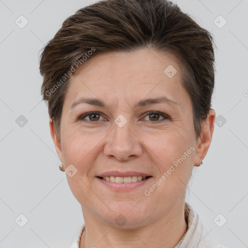 Joyful white adult female with short  brown hair and brown eyes