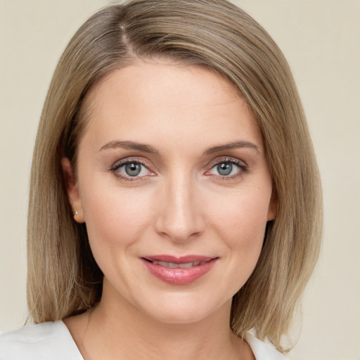 Joyful white young-adult female with medium  brown hair and green eyes