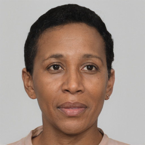 Joyful black adult female with short  black hair and brown eyes