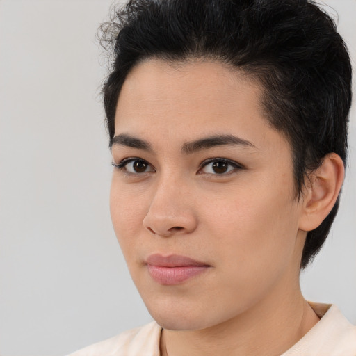 Joyful latino young-adult female with short  brown hair and brown eyes