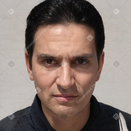 Joyful white adult male with short  black hair and brown eyes