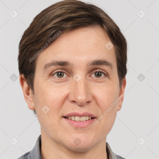 Joyful white adult male with short  brown hair and grey eyes