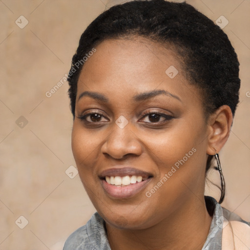 Joyful black young-adult female with short  black hair and brown eyes